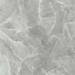 Gres porcellanato effetto onice grigio. La superficie mostra una complessa stratificazione di varie tonalità di grigio, da chiaro a medio, con venature bianche interconnesse che creano una texture ricca e dettagliata