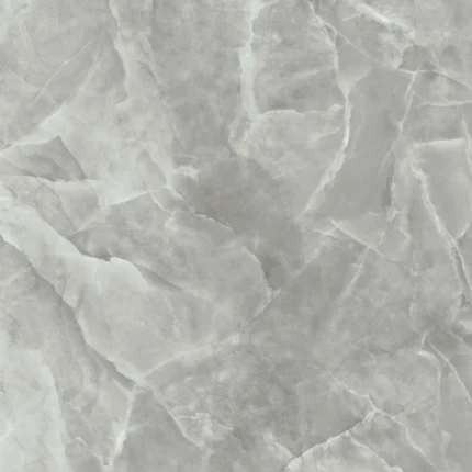 Gres porcellanato effetto onice grigio. La superficie mostra una complessa stratificazione di varie tonalità di grigio, da chiaro a medio, con venature bianche interconnesse che creano una texture ricca e dettagliata