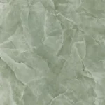 Lastra di gres porcellanato che imita l'onice giada. Lo sfondo è di un delicato colore verde salvia, con venature lattiginose e aree più chiare che richiamano l'aspetto della pietra di giada naturale