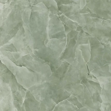 Lastra di gres porcellanato che imita l'onice giada. Lo sfondo è di un delicato colore verde salvia, con venature lattiginose e aree più chiare che richiamano l'aspetto della pietra di giada naturale